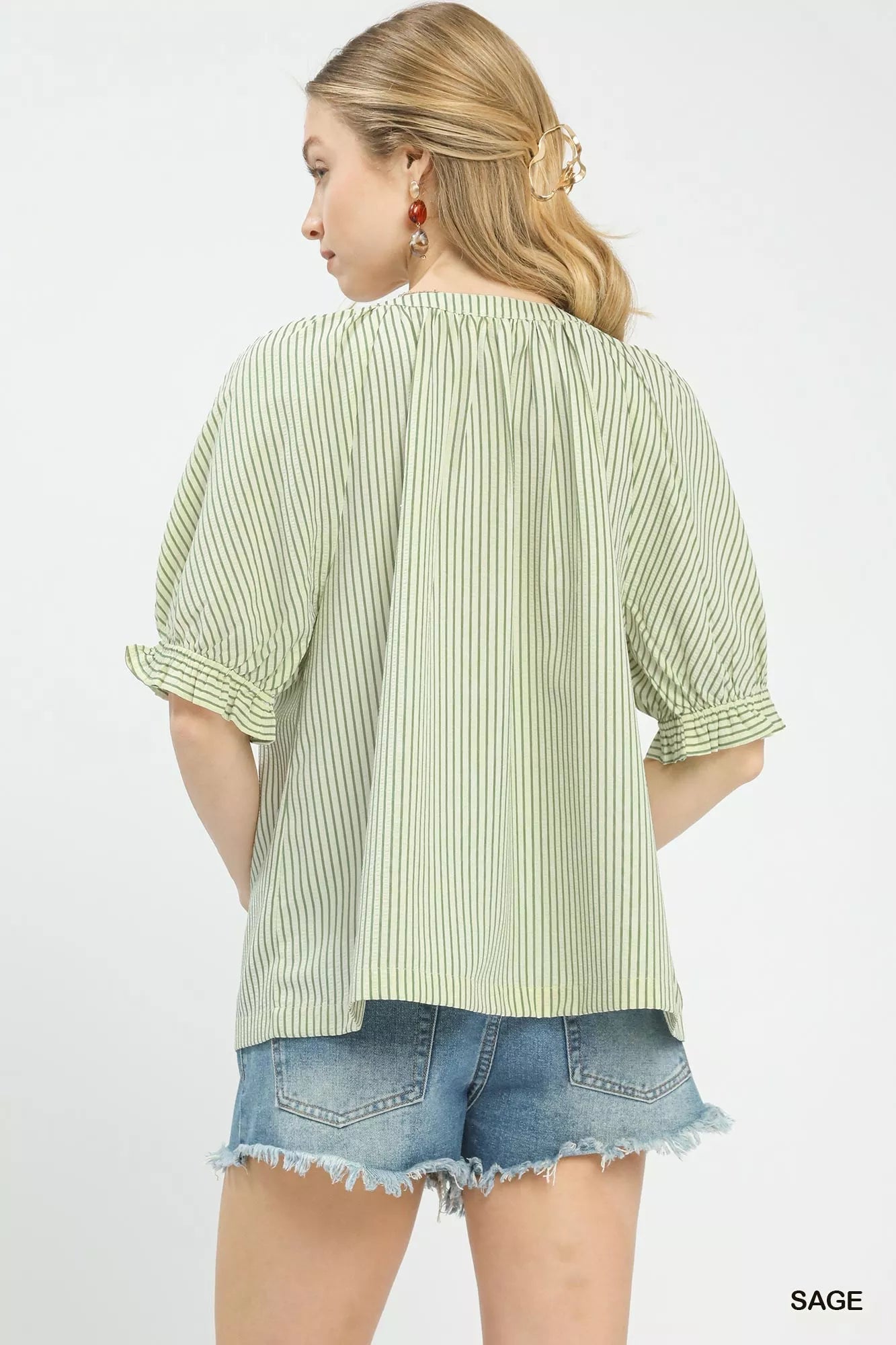 Sage green Umgee stripe V-neck blouse from Trendsi, featuring a relaxed fit and lightweight fabric for casual wear.