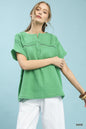 Sage green Umgee boho blouse with textured gauze fabric, split neckline, long sleeves, and relaxed fit, styled for casual wear.