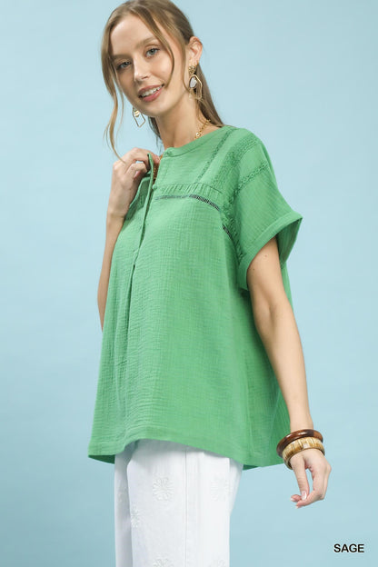 Sage green Umgee textured gauze boho blouse with split neckline and relaxed fit, styled for casual and bohemian looks.