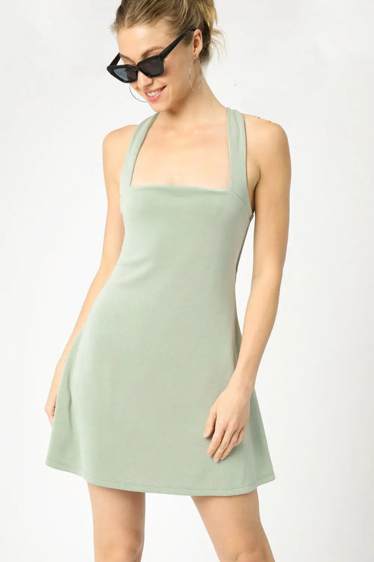 Sage green Umgee crisscross square neck active dress by Trendsi, shown in XS size with a stylish and comfortable fit.
