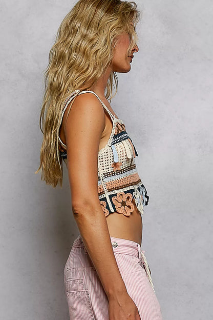Salmon-colored POL cutout flower cropped crochet cami with dangle detail, featuring a floral design and sleeveless fit.