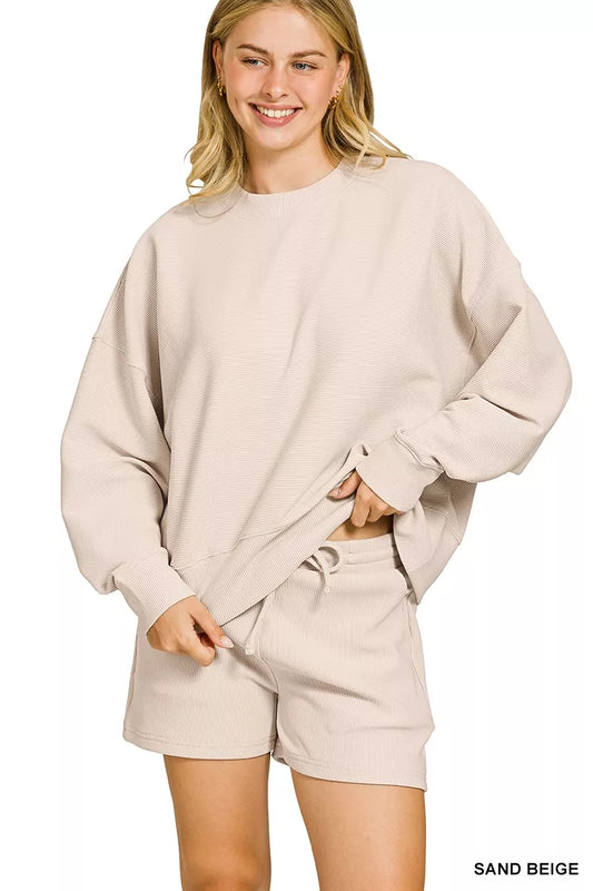 Sand beige Zenana ribbed round neck pullover and shorts set, featuring a cozy knit texture and casual fit.