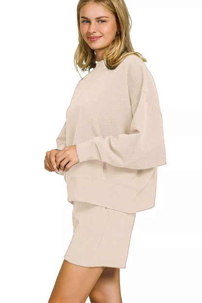 Sand beige Zenana ribbed pullover and shorts set by Trendsi, featuring a round neck and comfortable, casual style.