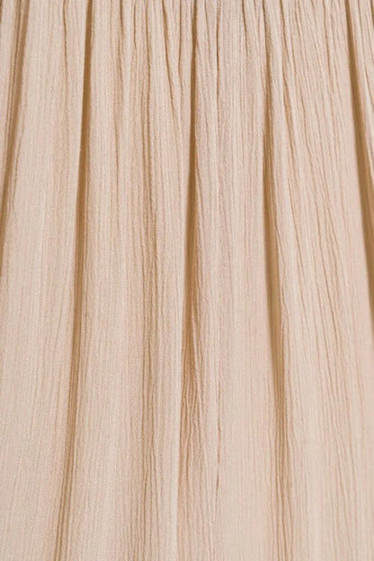 Sand beige Zenana woven crinkle maxi skirt with smocked waist and pockets, featuring a flowy, comfortable design.
