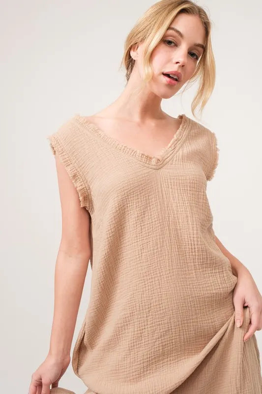 Sand-colored And The Why washed fringe detail tiered dress with layered fabric and boho style, perfect for casual summer wear.