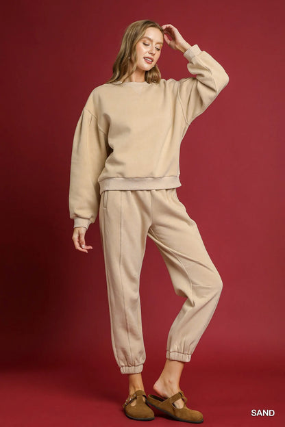 Sand-colored Umgee fleece jogger pants with drawstring waist and relaxed fit, styled for casual comfort.