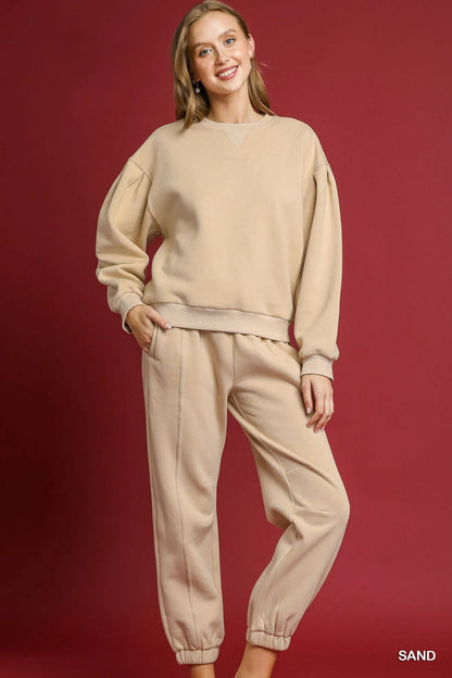 Light beige Umgee fleece jogger pants with drawstring waist and elastic cuffs, casual and comfortable for everyday wear.
