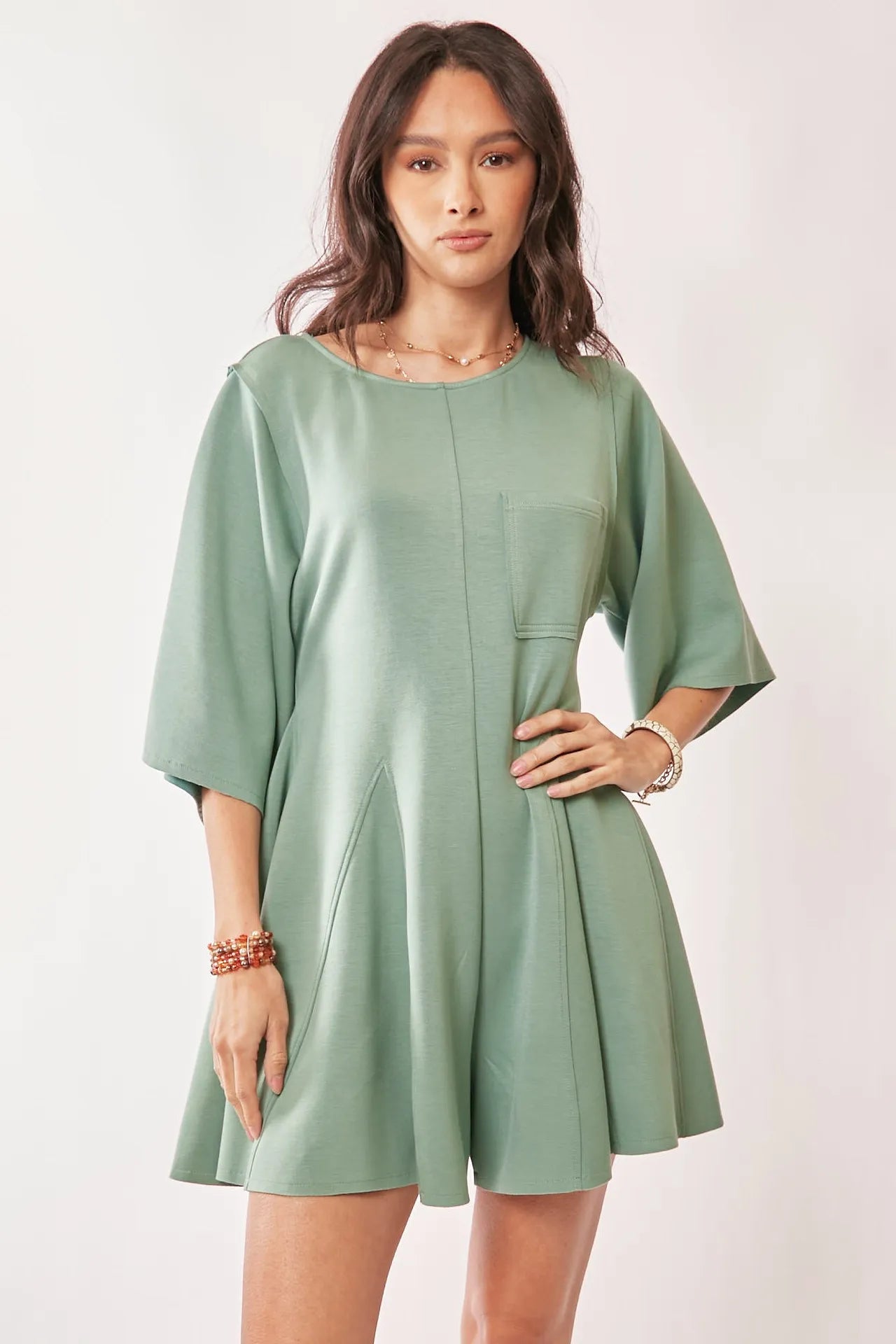 Seafoam green Davi & Dani solid skort romper with draped sleeves and ties at the back, stylish and comfortable for warm weather.
