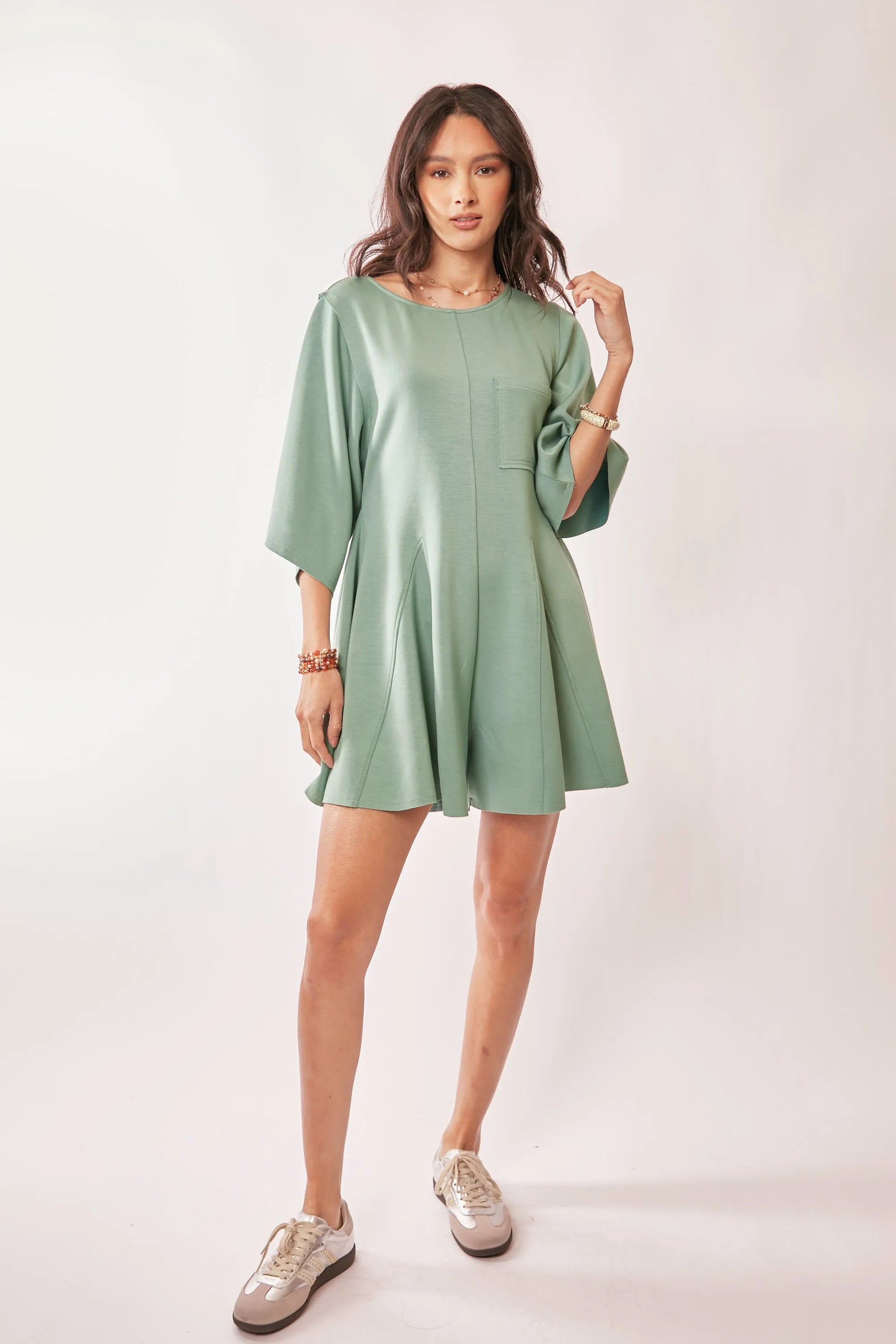 Seafoam green Davi & Dani solid skort romper with draped sleeves and ties at the back, casual and stylish for warm weather.