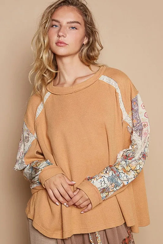Sherbet-colored POL waffle-knit round neck top with lace details from Trendsi, featuring a comfortable fit and stylish design.