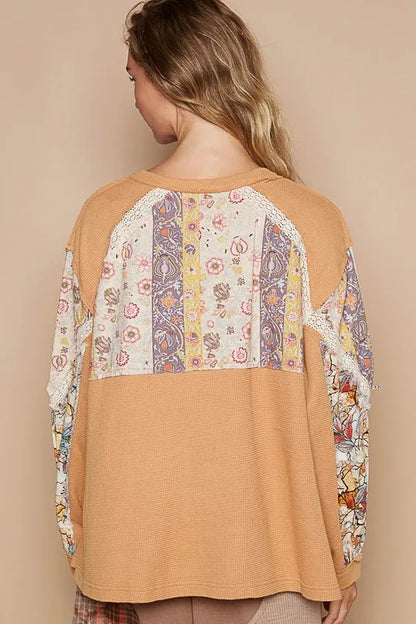 Sherbet-colored waffle-knit lace detail round neck top from Trendsi, featuring soft fabric and stylish design.