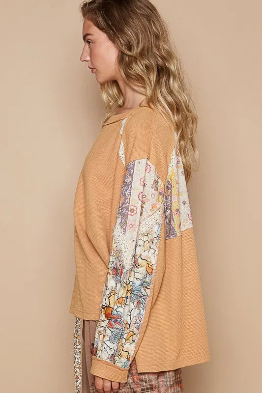 Light orange waffle-knit lace detail round neck top by Trendsi, featuring a cozy fabric and delicate lace accents.