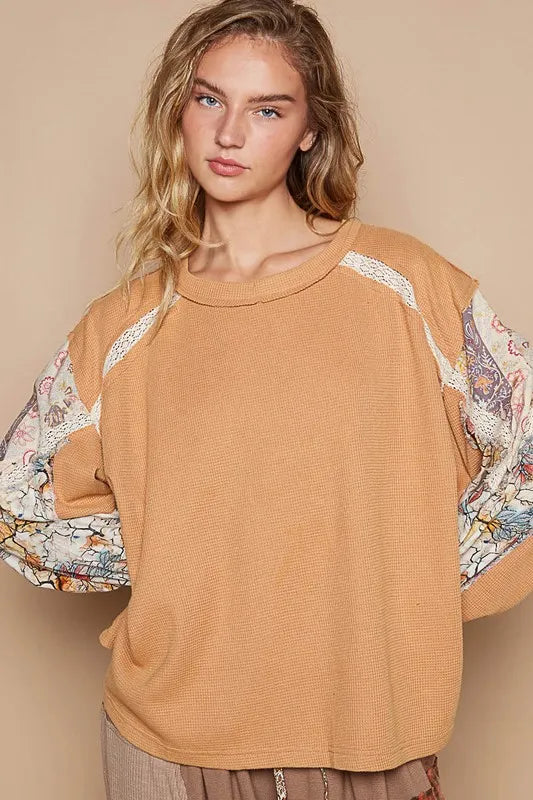 Sherbet-colored waffle-knit lace detail round neck top by Trendsi, featuring a comfortable fit and stylish design.