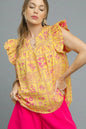 Umgee printed ruffle cap sleeve blouse in sherbet color, featuring a stylish design and feminine ruffle details.