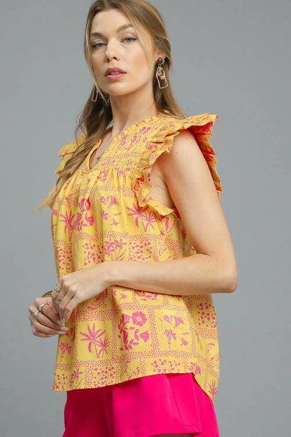 Umgee printed ruffle cap sleeve blouse in sherbet color, stylish and lightweight with floral design and ruffle details.