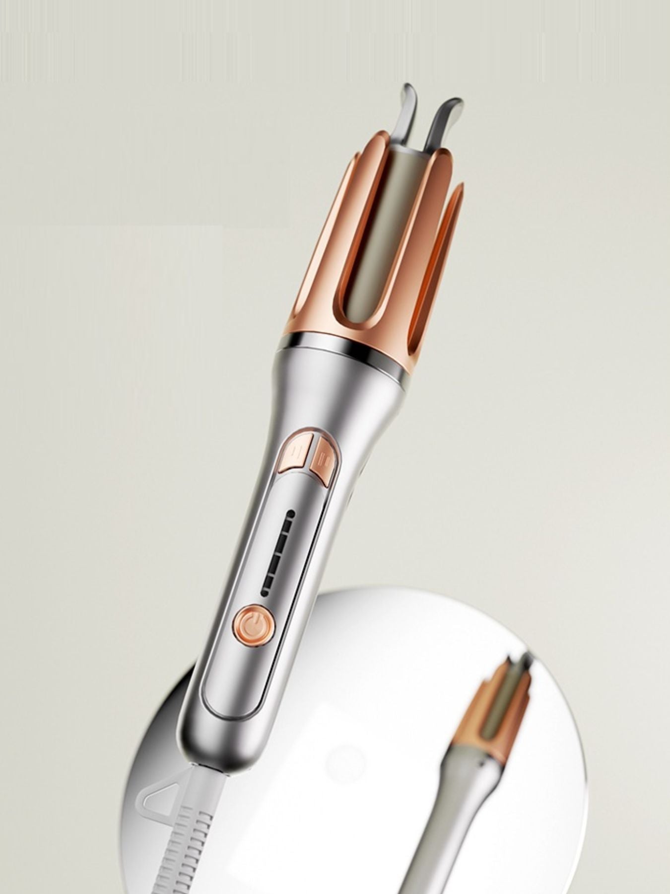 Silver automatic hair curling iron by Trendsi with European plug, showcasing its sleek design and curling barrel.