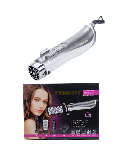 Silver lightweight hot air brush by Trendsi with European plug, shown in use for styling and drying hair.