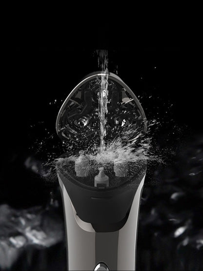 Silver gray electric rotary shaver with LED display, Trendsi brand, showing close-up of shaving head and control panel