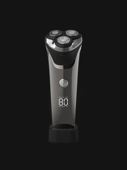 Silver-gray electric rotary shaver with LED display from Trendsi, featuring multiple rotary heads and a sleek ergonomic design.