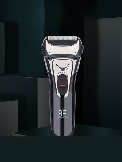 Silver electric shaver with digital display from Trendsi, showing close-up of shaver head and sleek design.