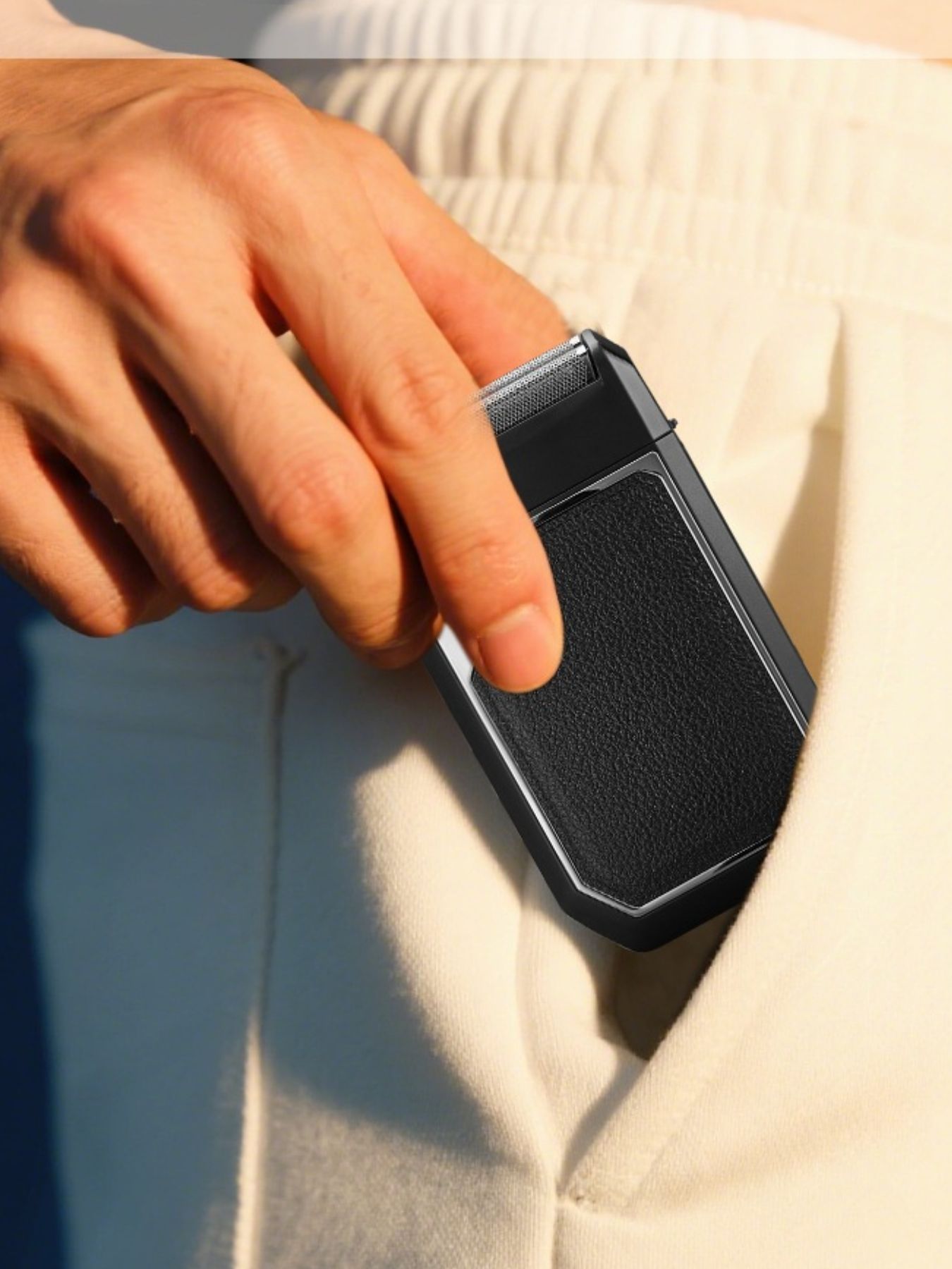 Silver portable electric foil shaver by Trendsi with a compact design for easy grooming.