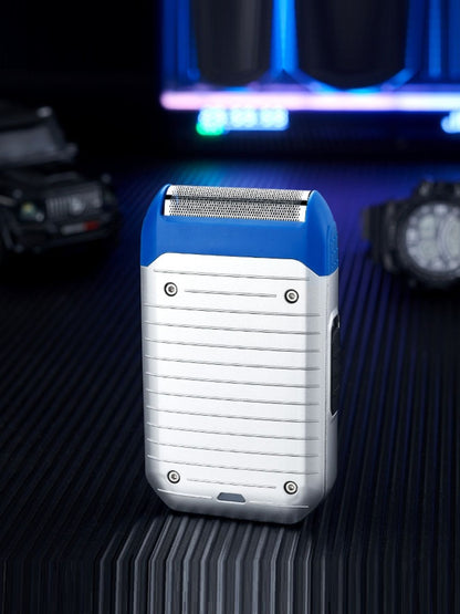 Silver portable mini shaver by Trendsi with compact design, ideal for on-the-go grooming and precision shaving.