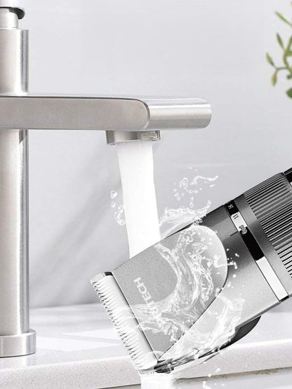 Silver cordless rechargeable hair clipper by Trendsi with a sleek design, suitable for professional or personal grooming.