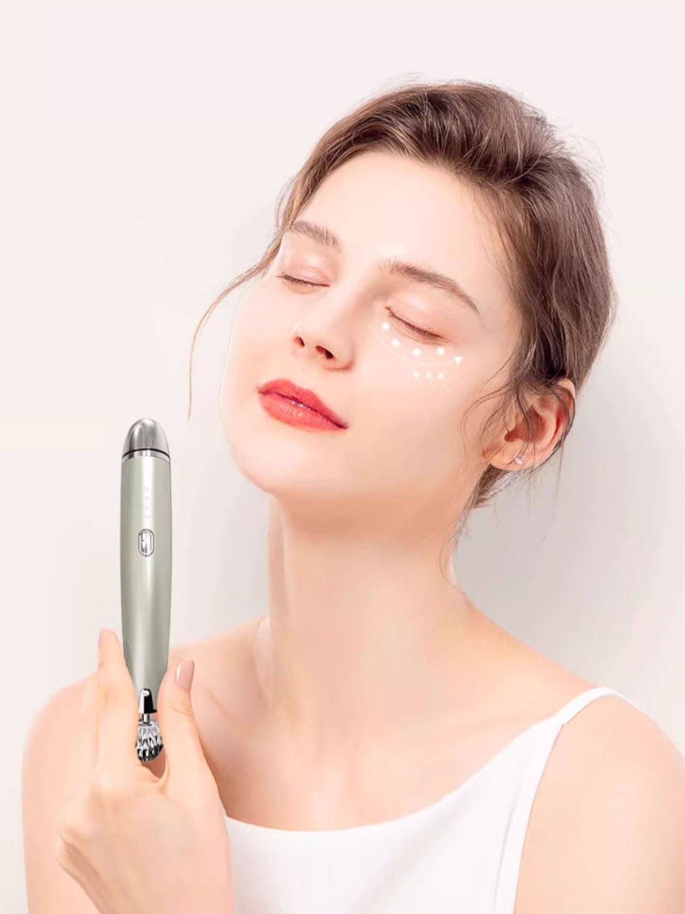 Silver facial lifting beauty device by Trendsi, compact design for skincare and facial contouring.