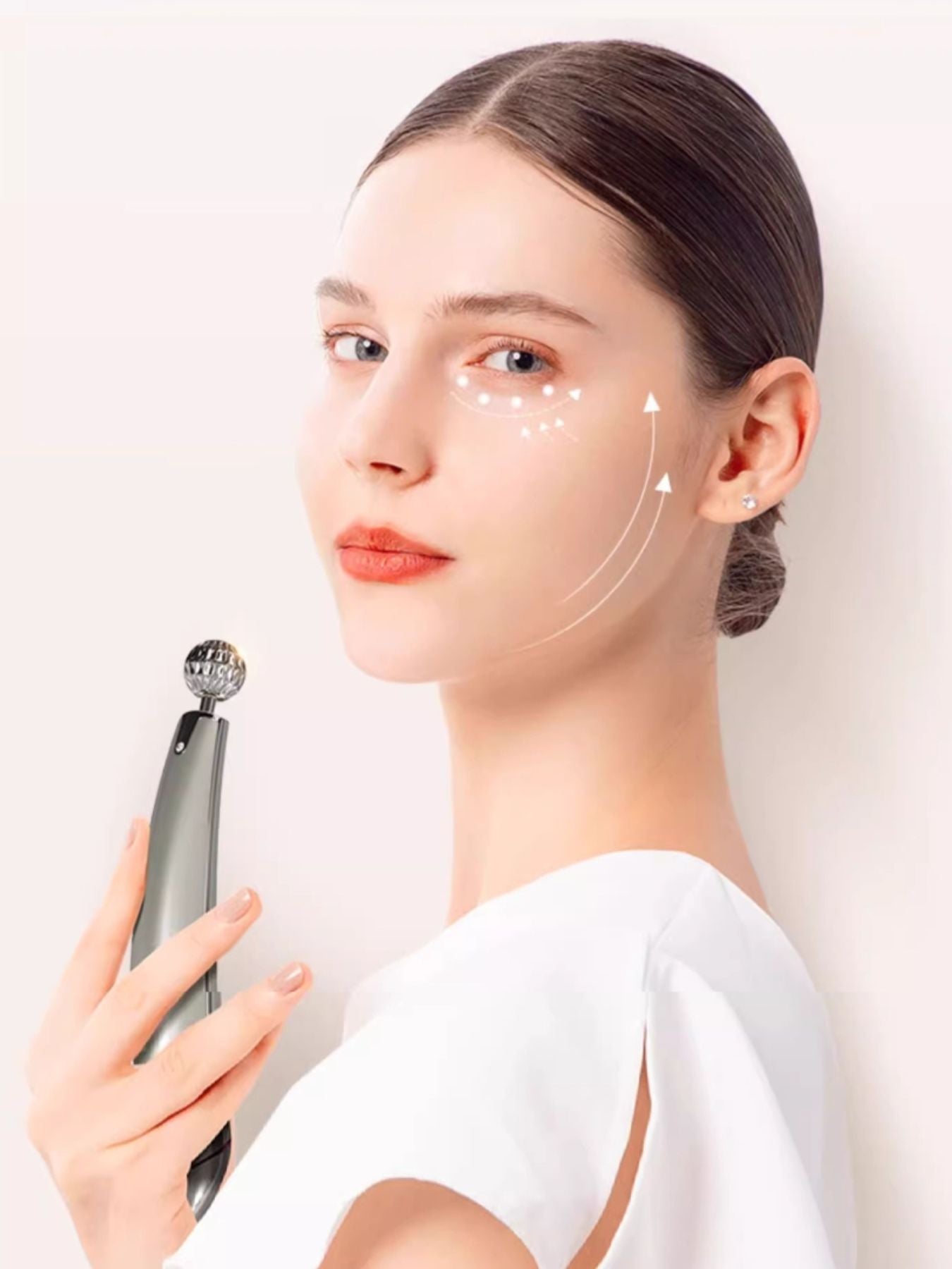 Silver facial lifting beauty device from Trendsi, handheld skincare tool with ergonomic design for facial contouring and skin tightening.