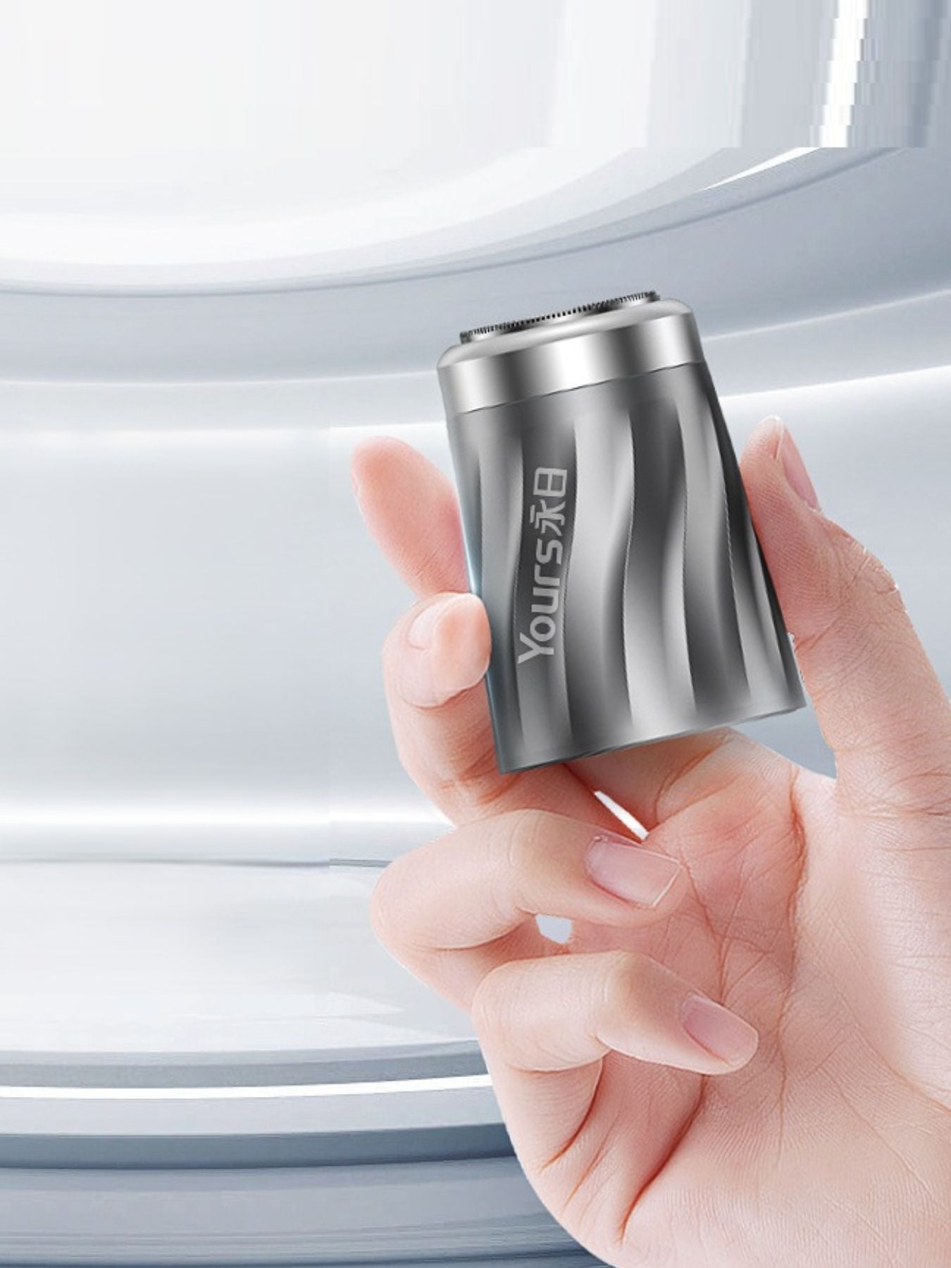 Silver portable mini electric shaver by Trendsi, compact handheld grooming tool with a sleek design for easy use.