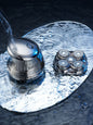Rechargeable silver 5-head rotary shaver with ergonomic design, ideal for smooth, close shaving.