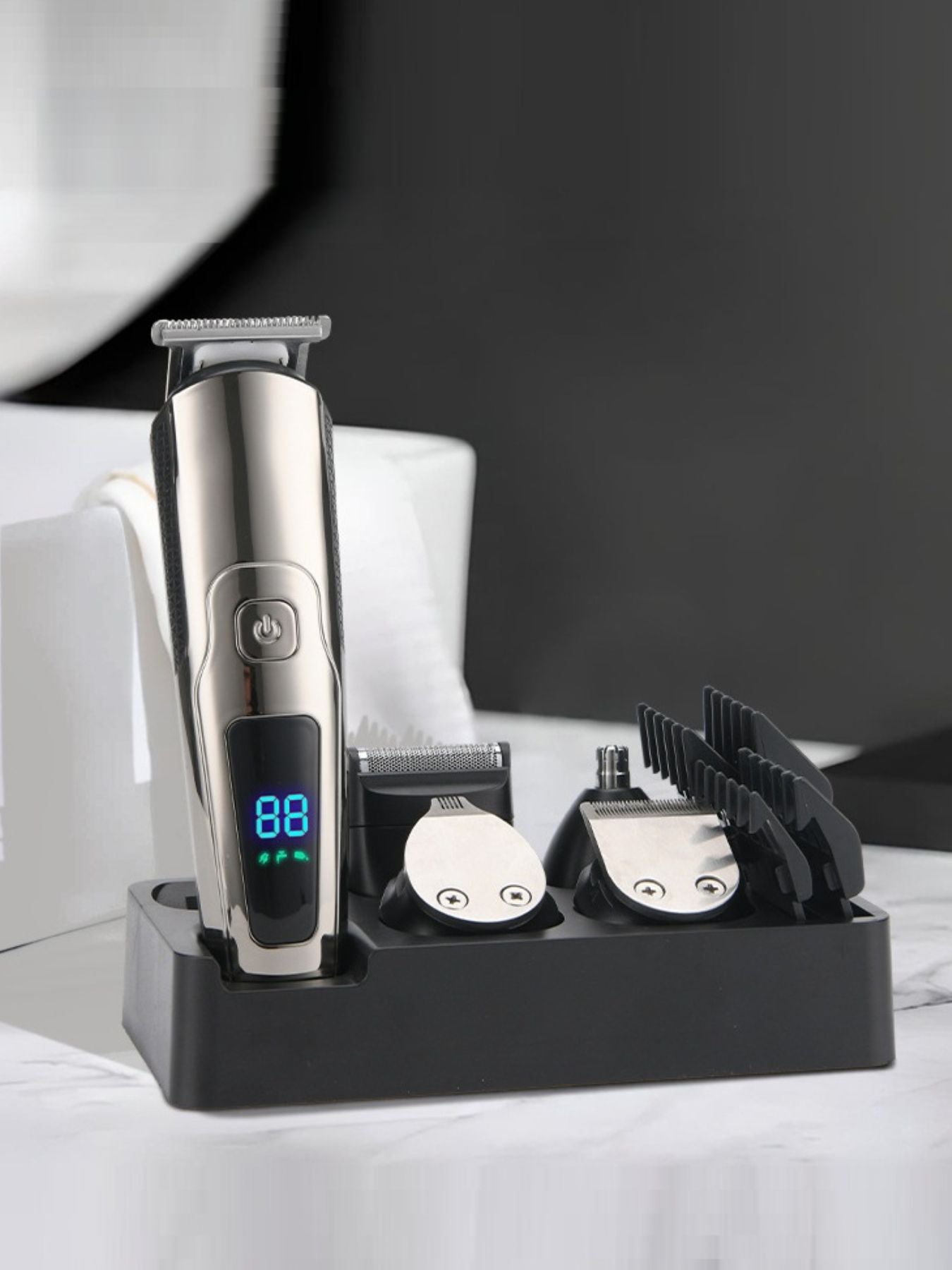 Silver waterproof hair clipper from Trendsi with LED display, designed for precise hair cutting and styling.