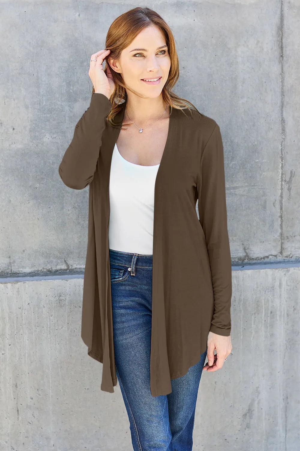 Sky-blue Trendsi Basic Bae open front long sleeve cardigan displayed on a hanger, showcasing its relaxed fit and soft fabric.
