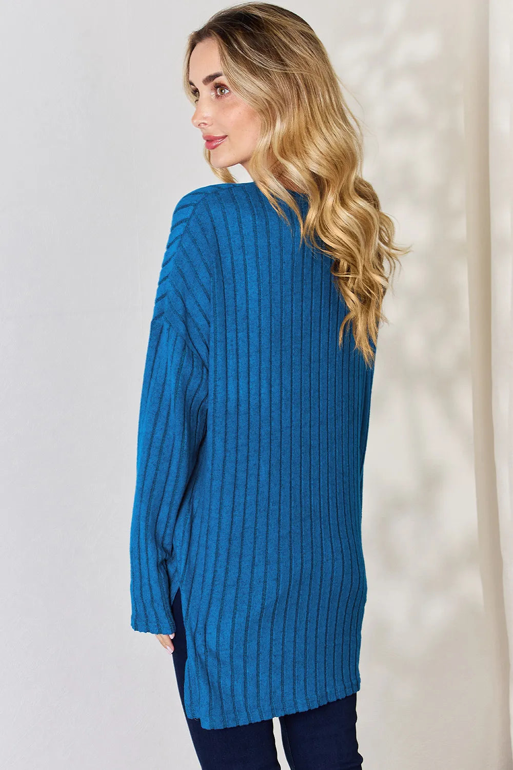 Sky blue ribbed long sleeve T-shirt with half-button front and high-low hem from Trendsi's Basic Bae collection.