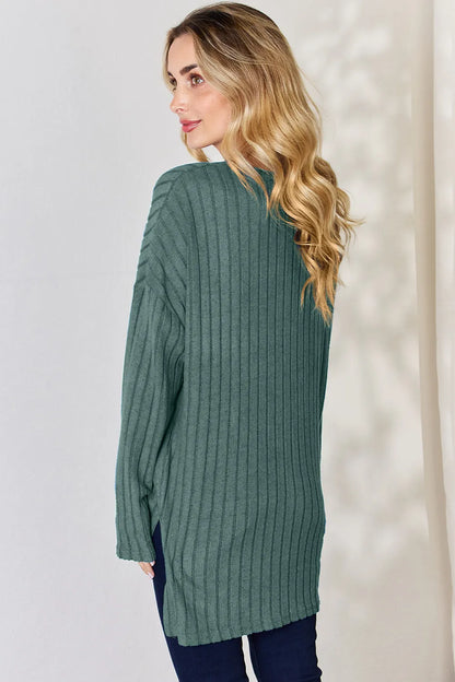 Sky blue Basic Bae ribbed long sleeve high-low T-shirt by Trendsi, featuring half-button front and casual, comfortable fit.