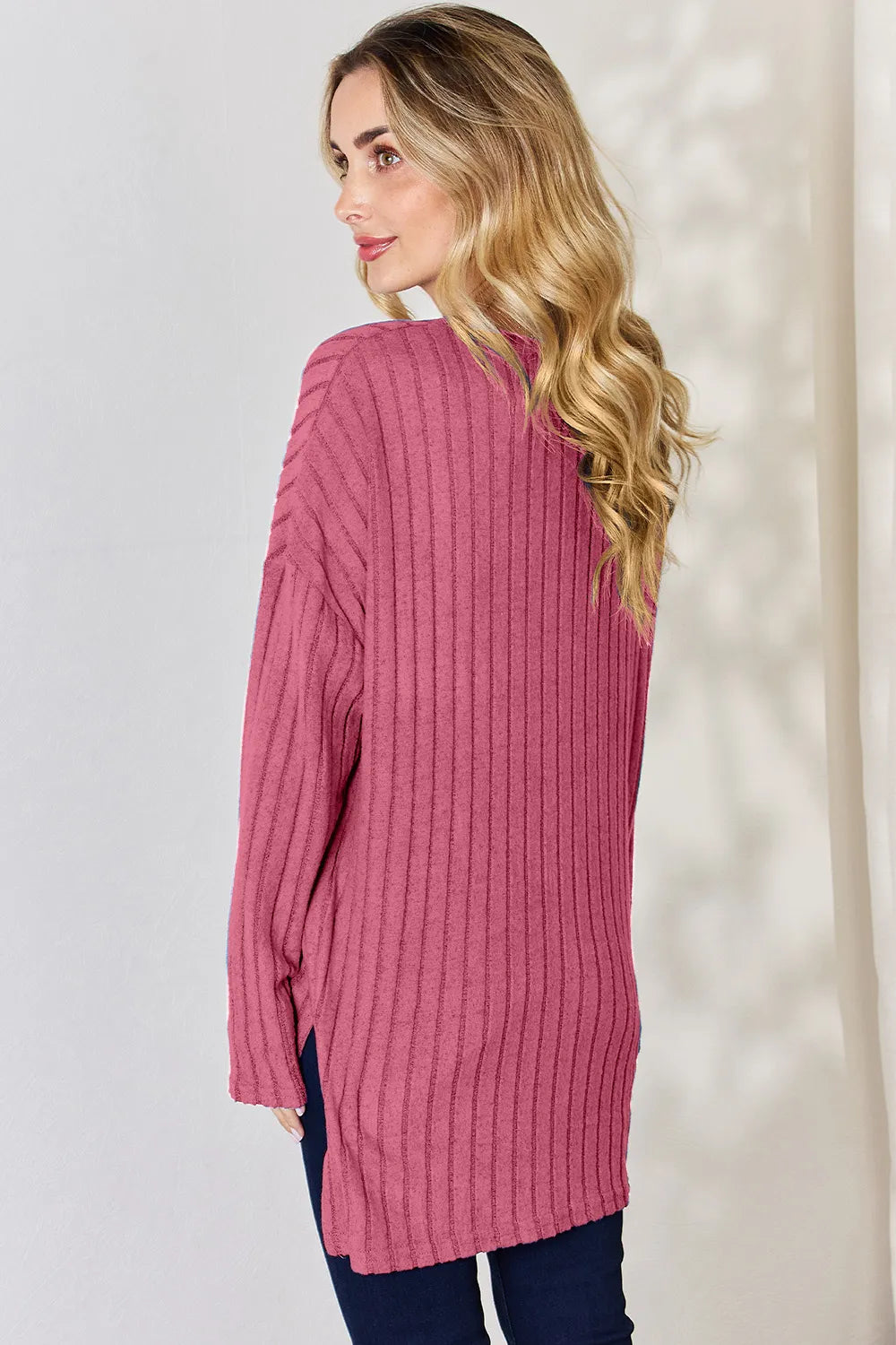 Sky blue Basic Bae ribbed long sleeve half-button high-low T-shirt by Trendsi, showing front view with ribbed fabric and high-low hem.