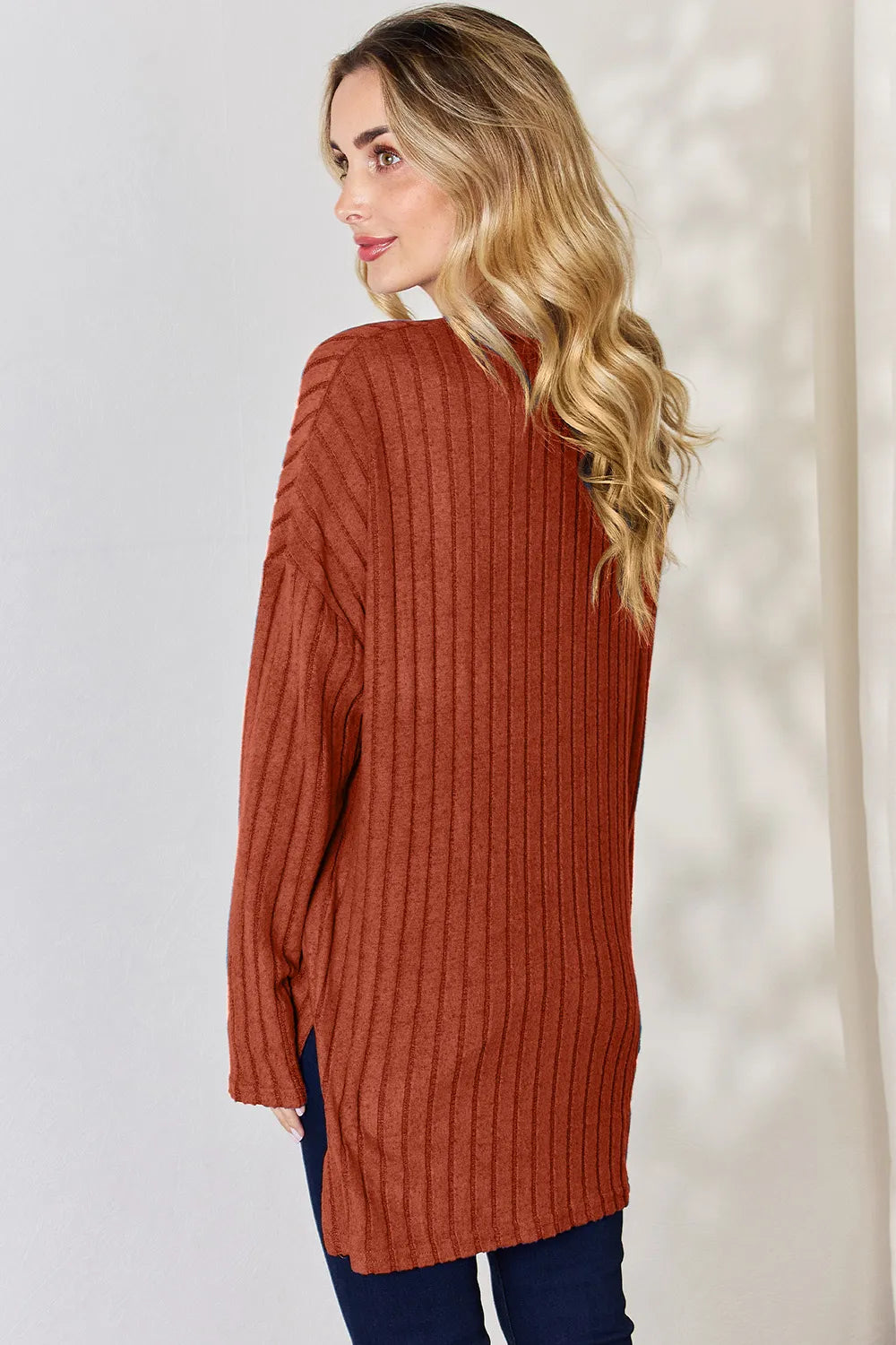 Sky-blue Basic Bae ribbed long sleeve T-shirt with half-button front and high-low hem, from Trendsi.