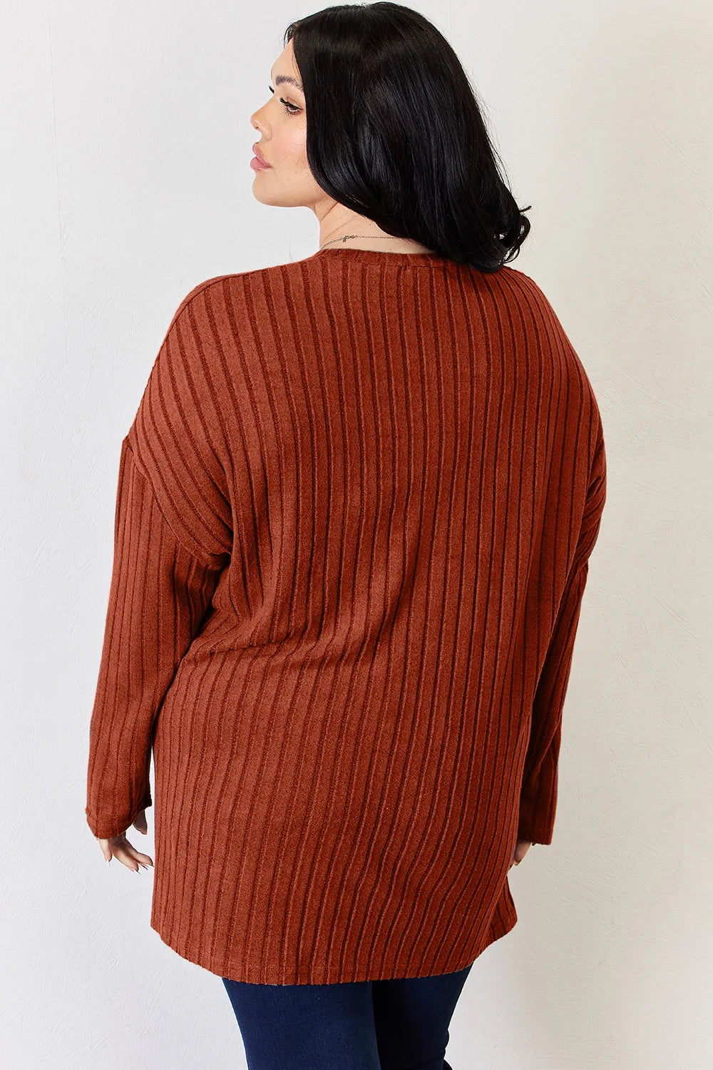 Sky-blue Basic Bae long sleeve ribbed half-button high-low T-shirt by Trendsi, featuring a relaxed fit and ribbed fabric.