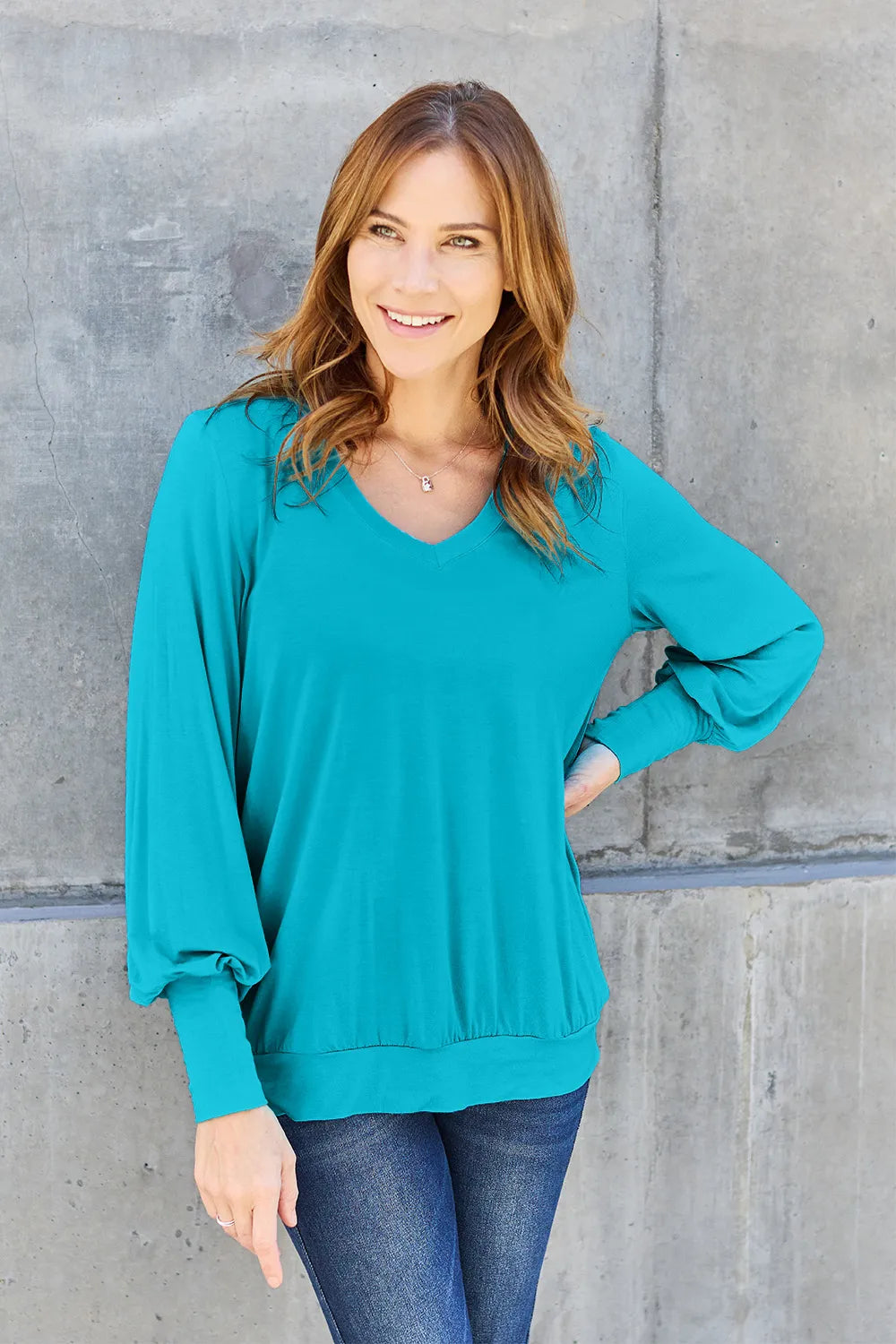 Sky-blue Basic Bae V-Neck Lantern Sleeve Top by Trendsi, full-size, lightweight fabric, with a relaxed fit and stylish lantern sleeves.