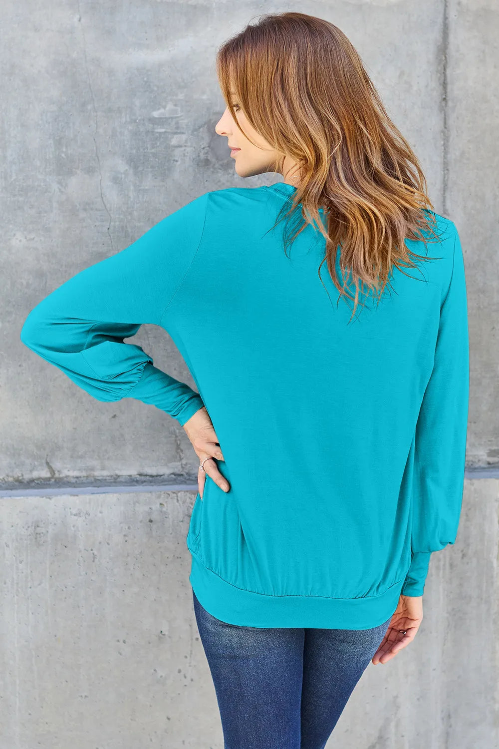 Sky-blue Basic Bae V-neck Lantern Sleeve Top by Trendsi, full-size, lightweight blouse with flowy lantern sleeves and V-neck design.