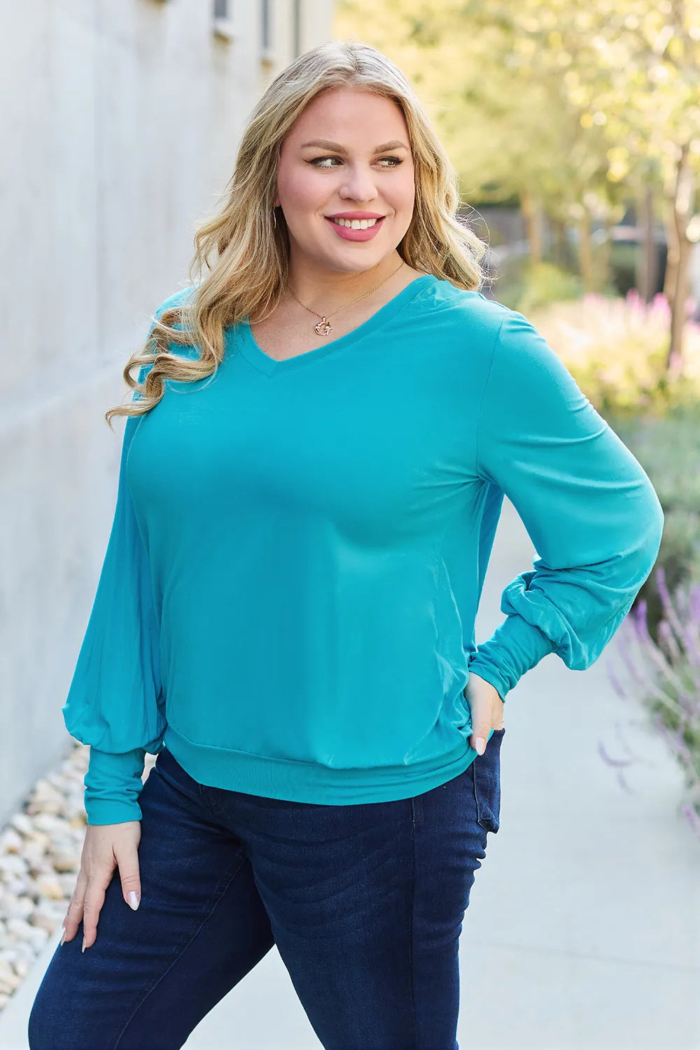 Sky blue Basic Bae V-neck lantern sleeve top by Trendsi, featuring a full size fit and stylish lantern sleeves.