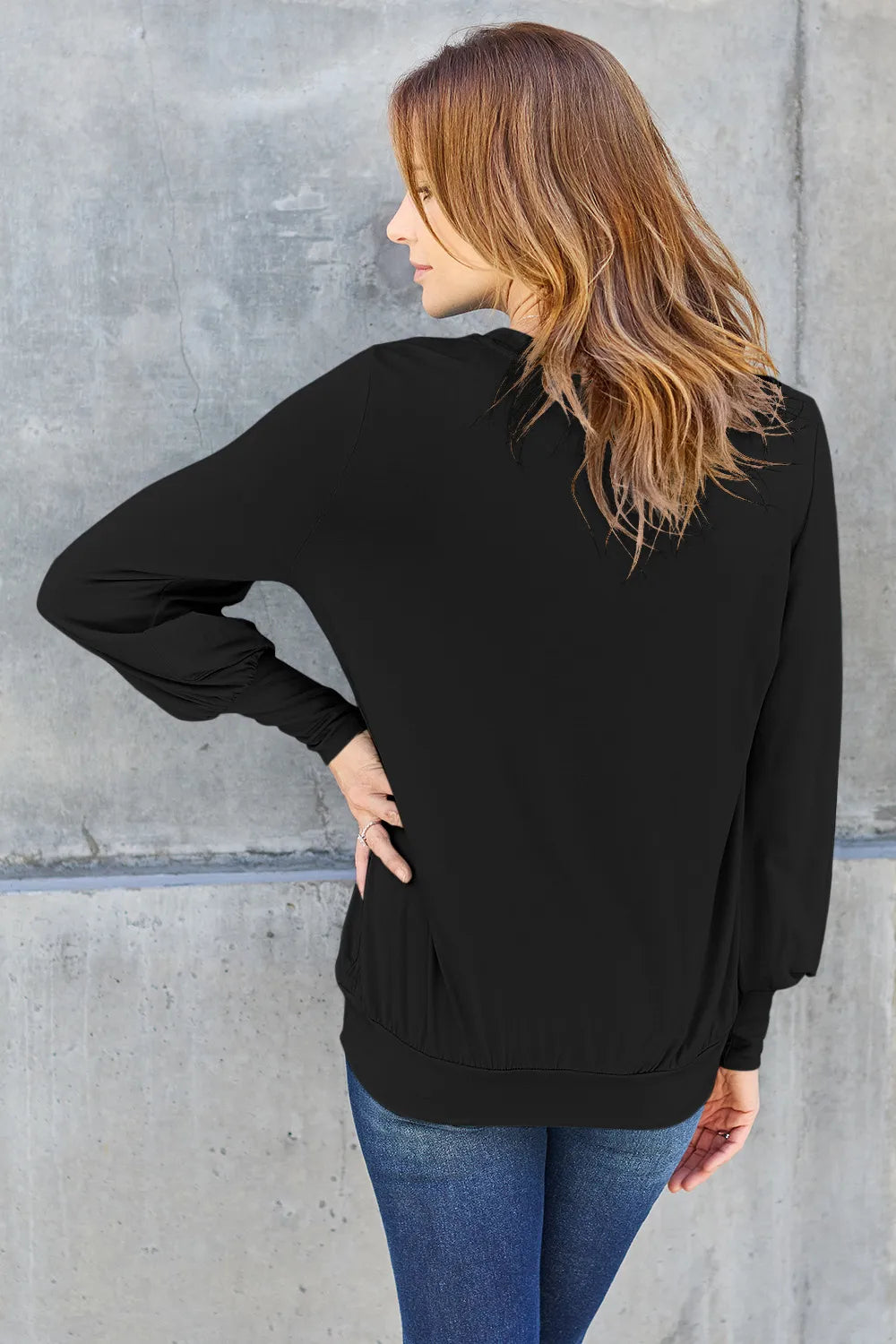 Sky-blue Basic Bae full-size V-neck lantern sleeve top by Trendsi, shown with its flowing sleeves and relaxed fit.