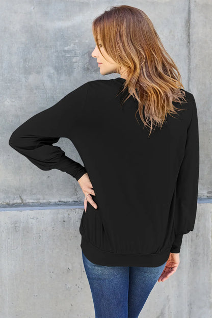 Sky-blue Basic Bae full-size V-neck lantern sleeve top by Trendsi, shown with its flowing sleeves and relaxed fit.