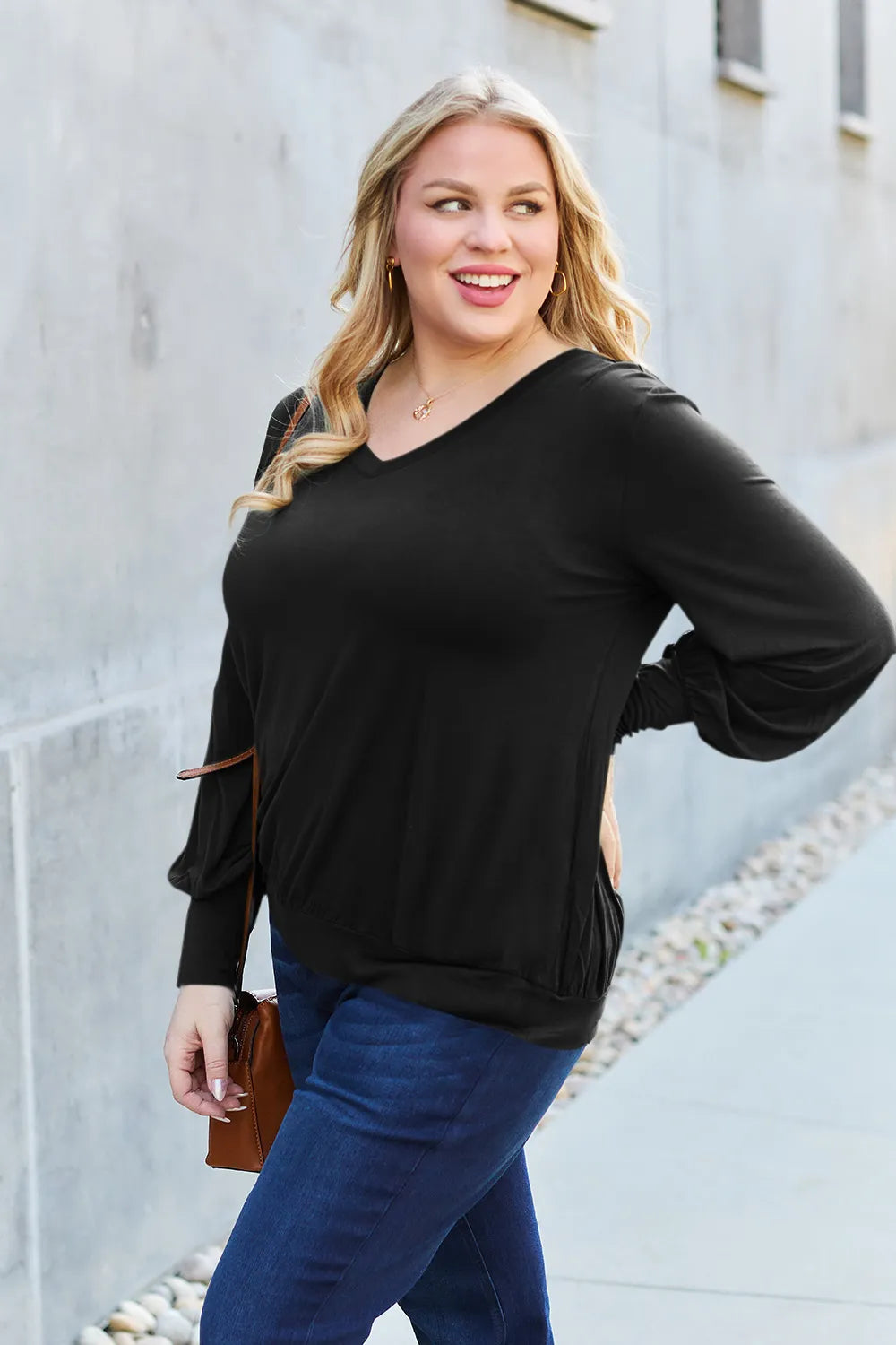 Sky-blue Trendsi Basic Bae V-Neck Lantern Sleeve Top displayed on a hanger, highlighting its full size and stylish design