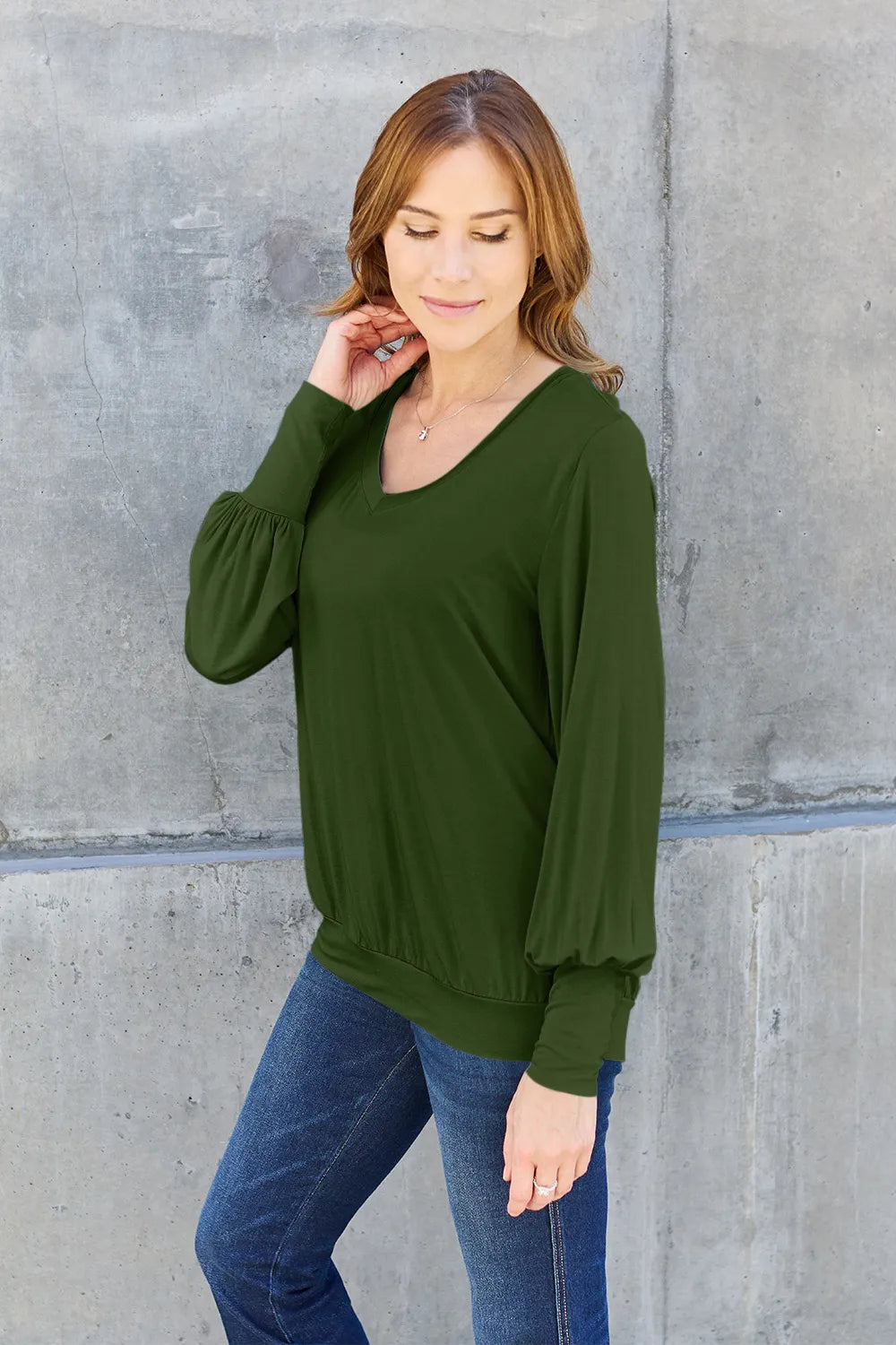 Sky-blue Basic Bae full-size V-neck lantern sleeve top by Trendsi, featuring a relaxed fit and stylish long lantern sleeves.