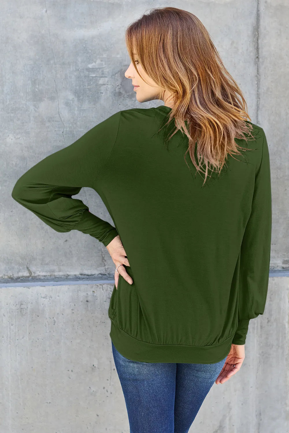 Sky blue Basic Bae full-size V-neck lantern sleeve top from Trendsi, showcasing a relaxed fit and stylish design.