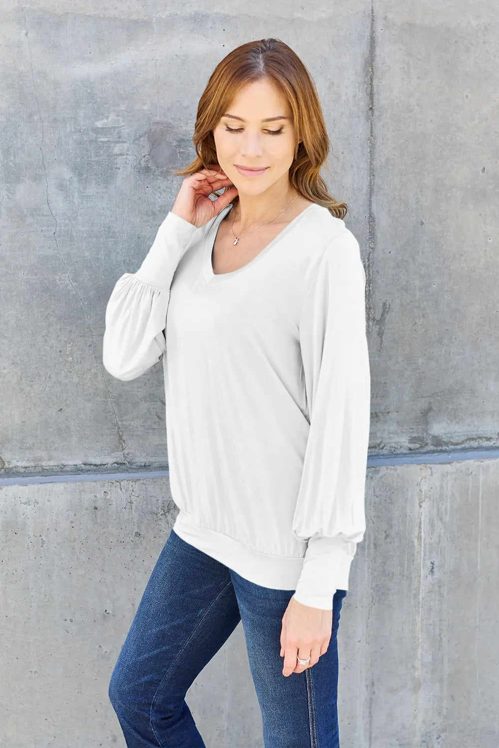 Sky blue Basic Bae full-size V-neck lantern sleeve top from Trendsi, featuring a relaxed fit and stylish design.