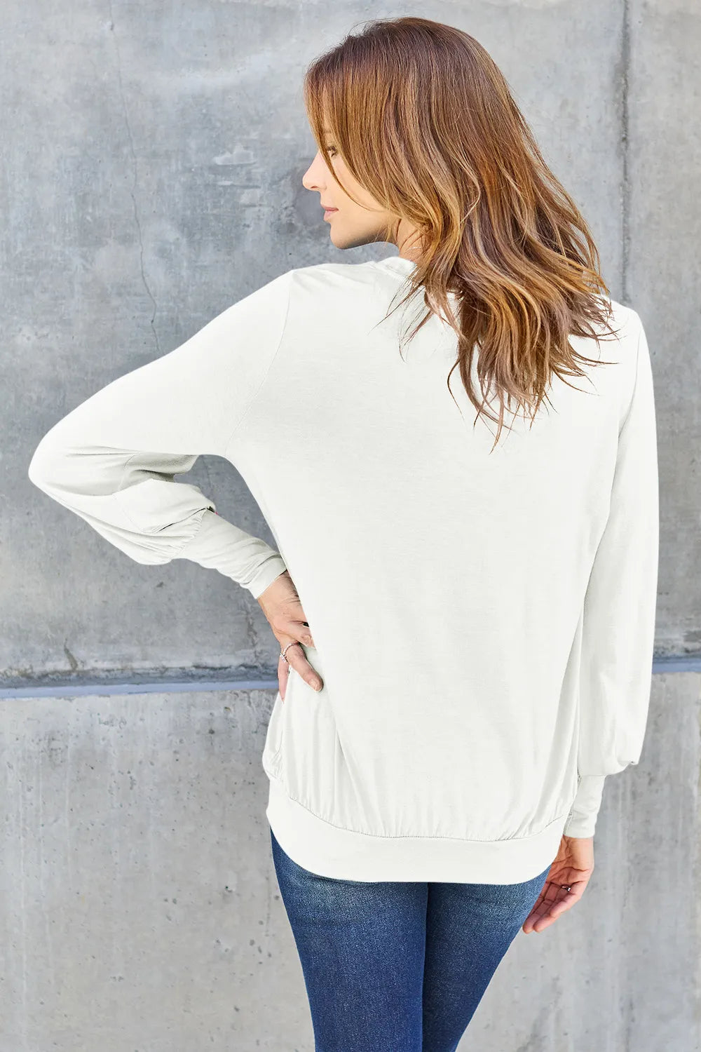 Sky blue Basic Bae V-neck lantern sleeve top by Trendsi, featuring a full size fit and stylish V-neck design.