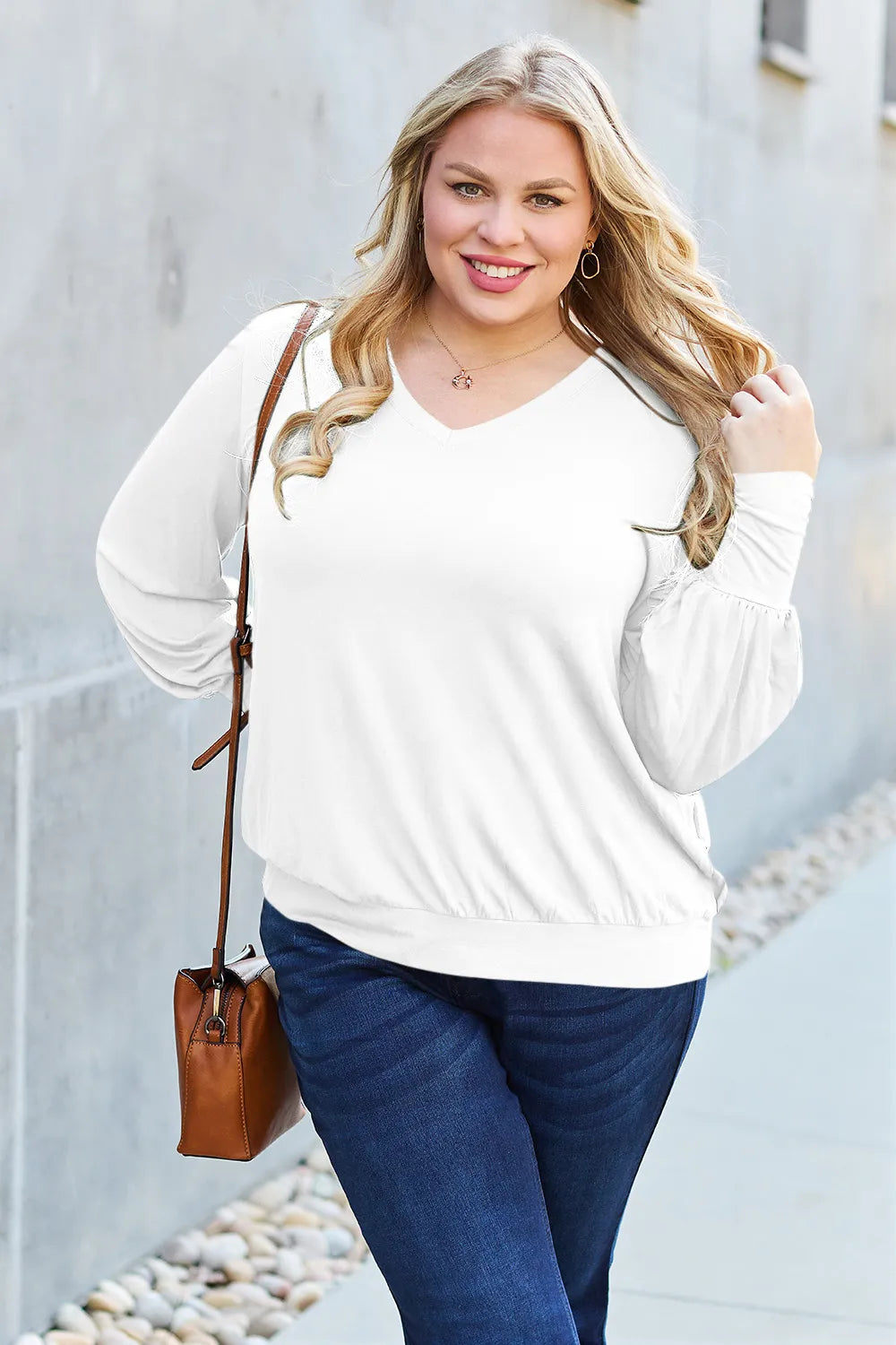 Sky blue Trendsi Basic Bae full-size V-neck lantern sleeve top shown on a model. Lightweight, casual style with flowing lantern sleeves.