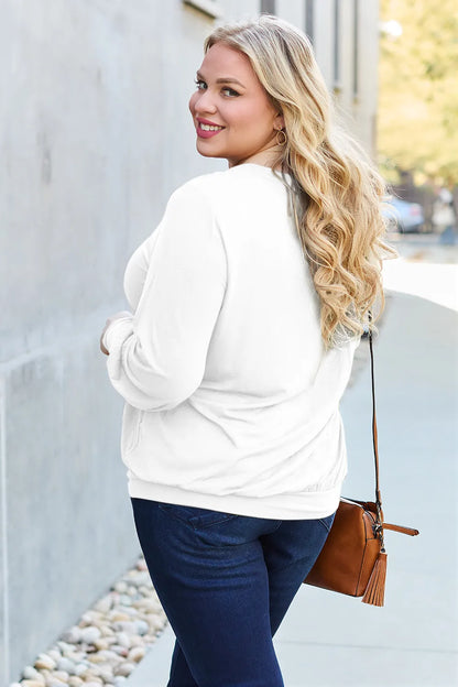 Sky blue Basic Bae full-size V-neck lantern sleeve top by Trendsi, featuring a relaxed fit and stylish design.
